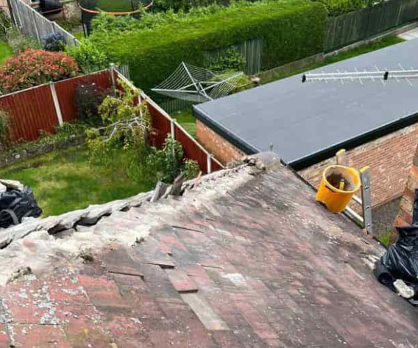 This is a photo of a roof hip that is having the hip (or bonnet) tiles replaced. Works carried out by EFG Roofing Maltby